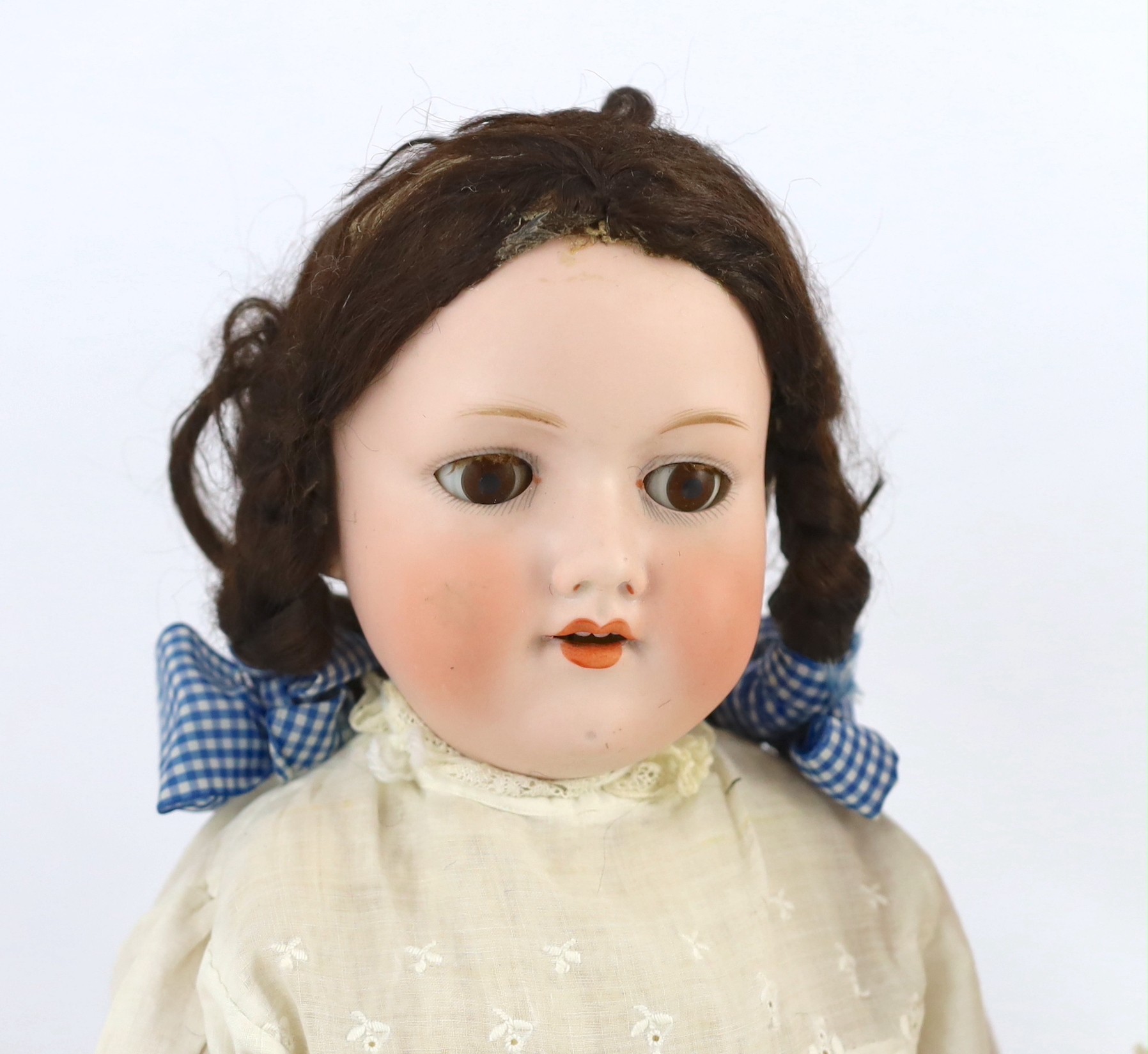 Two Armand Marseille bisque dolls, 23in. and 18in. resp.